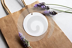 Gift tag mockup - Round gift tag surrounded by lavender flowers