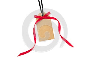 Gift tag with red bow isolated on white