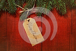 Gift tag on red wood background