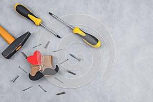 Gift and tools set on a gray background.