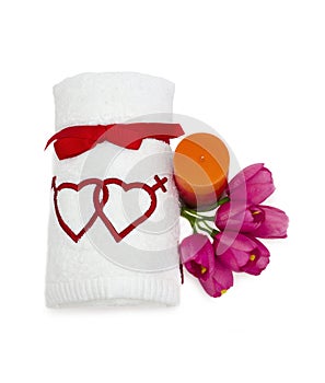 Gift towel with a candle and red tulips and candle
