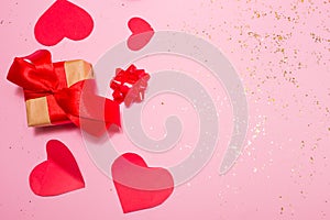 gift valentine on the pink background on the table