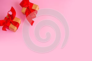 gift valentine on the pink background on the table