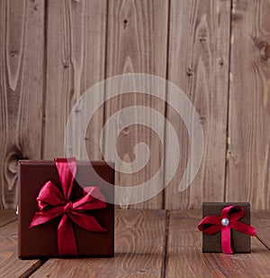 Gift on wooden table. Photo in old color image style