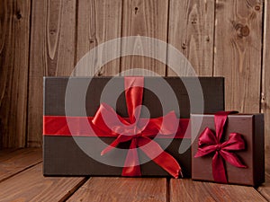 Gift on wooden table. Photo in old color image style