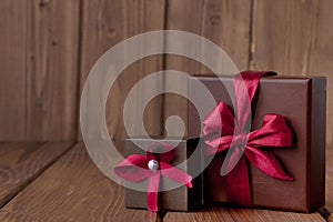 Gift on wooden table. Photo in old color image style