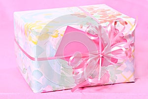 Gift Wrapped Package on pink