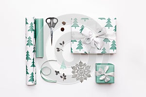Gift wrapping composition. Nordic christmas gifts isolated on white background. Turquoise colored wrapped gift boxes.