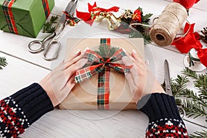 Gift wrapping. Packaging modern christmas present in boxes