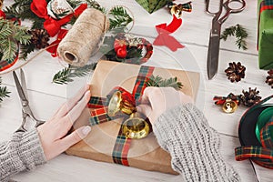 Gift wrapping. Packaging modern christmas present in boxes