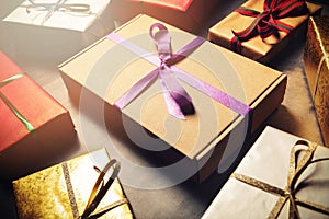 Gift wrapping service - wrapped present boxes on dark table