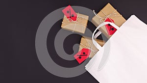 Gifts for big discount shopping sale appear from shopping bag. Stop motion