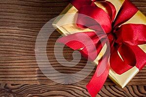 Gifts boxes with fir branches on wooden background top view
