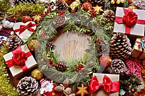 Gifts and christmas ornaments on a rustic wooden table