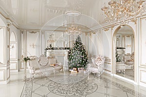 Gifts at the Christmas tree. Christmas morning. classic luxurious apartments with a white fireplace, sofa, large windows