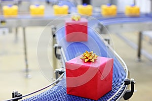 Gifts on conveyor belt in Christmas presents facto