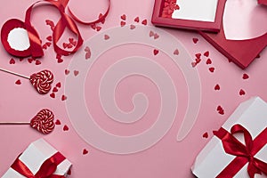 Gifts and hearts on pink background top view. Love. Valentines day background with place for text insertion