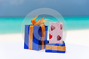 Gifts packed with ribbonsfor Saint Valentine\'s day holiday at the tropical beach