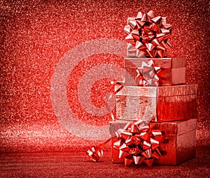 Gifts ribbon bow red background. Holidays decoration