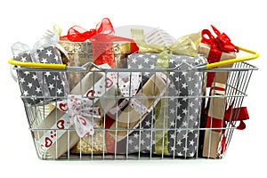 Gifts in shopping basket closeup