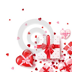 Gifts in square and hearts shaped boxes with silk ribbon and bow. Present for Valentine`s day decorated confetti. Template for