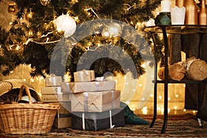 Gifts under the Christmas tree lights background 2018