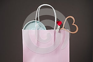 Gifts are visible from the pink gift bag.