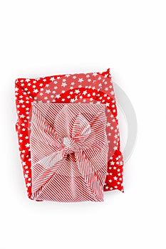 Gifts wrapped in red holiday furoshiki wrapping cloth