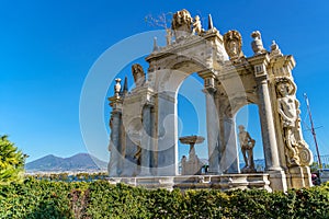 The Gigante Fountain on the seafront of Naples Campania Italy, The Vesuvius Volcano on background photo