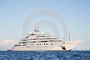 Gigantic big and large luxury mega or super motor yacht on the o