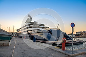 Gigantic big and large luxury mega yacht in marina of Zeas, Greece. Investment for billionaires.