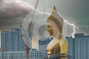 Gigantic Buddha statue under construction with lightning streak in background