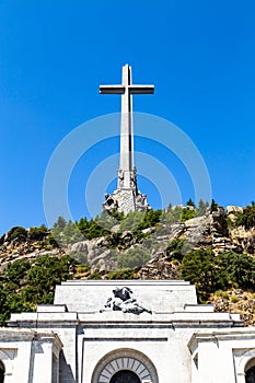 The gigantic cross on the top of the Valley of the Fallen Valle de Los Caidos, Madrid, Spain photo