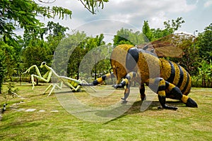 Gigantic sculptures in the form of a praying mantis, bumblebee, hornet, bee