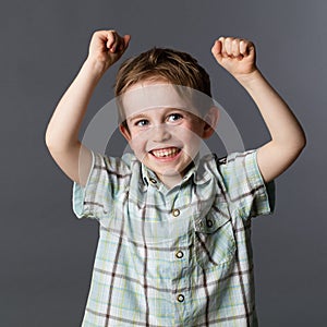 Giggling preschool child enjoying his winning success