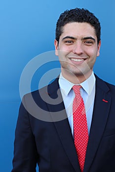 Giggly businessman in blue background