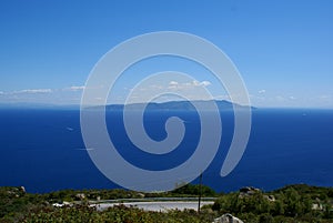 Giglio Island, Italy: a view of the Tyrrhenian Sea and Monte Argentario on the mainland