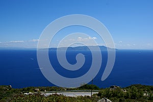 Giglio Island, Italy: a view of the Tyrrhenian Sea and Monte Argentario on the mainland photo