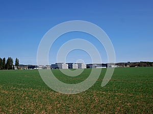 Gilching Munich upper Bavaria industrial zone - business building, green field and blue sky