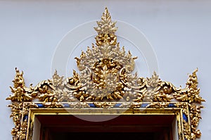 Gild Ornamental Door of Wat Pho Monastery. photo