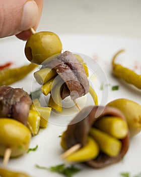 Gilda is a traditional pincho or tapa from the Basque Country that is prepared with anchovies, olives and pickled chillies.