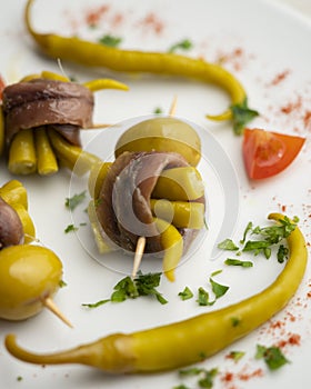 Gilda is a traditional pincho or tapa from the Basque Country that is prepared with anchovies, olives and pickled chillies.