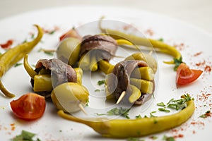 Gilda is a traditional pincho or tapa from the Basque Country that is prepared with anchovies, olives and pickled chillies.