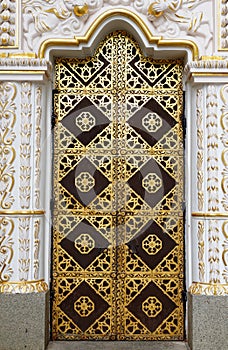 Gilded door of the Dormition cathedral of Kyiv Pechersk Lavra Kiev Monastery of the Caves in Kiyv, Ukraine