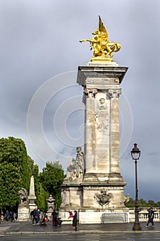 Gilded Fames sculptures Pegasus on the socle counterweights on Pont Alexandre III in Paris, France