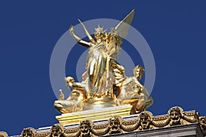Gilded figural group Harmonie atop the Palais Garnier in Paris photo