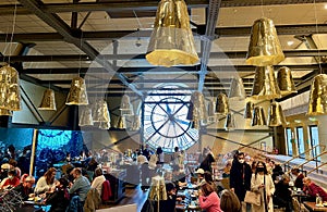 Gilded lamps hang over the Cafe Campana in the Musee d`Orsay, Paris, France