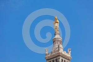Gilded statue of Virgin with child in Marseille photo