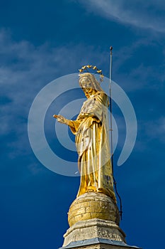 Gilded statue of Virgin Mary at Notre-Dame des Doms cathedral in Avignon, France