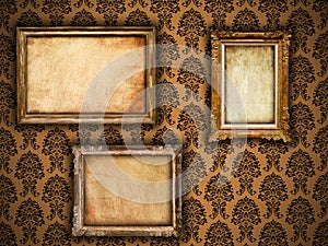 Gilded vintage frames on damask wallpaper